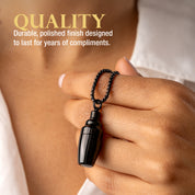 Hand holding the black cocktail shaker necklace with text about quality and durability.