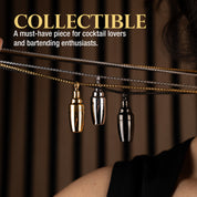 Three metallic cocktail shaker pendants in silver, gold, and black, perfect for cocktail lovers and bartenders.